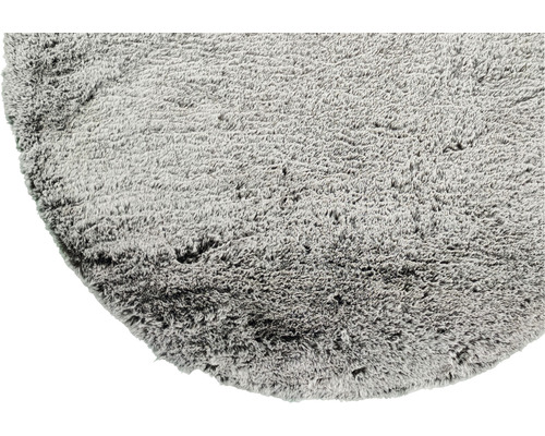 Grijs rond hoogpolig tapijt