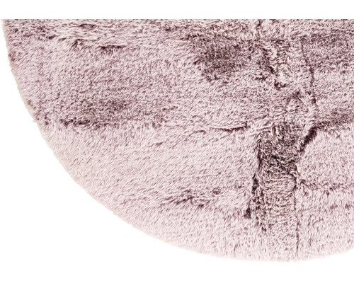 Detail van een rond, harig tapijt