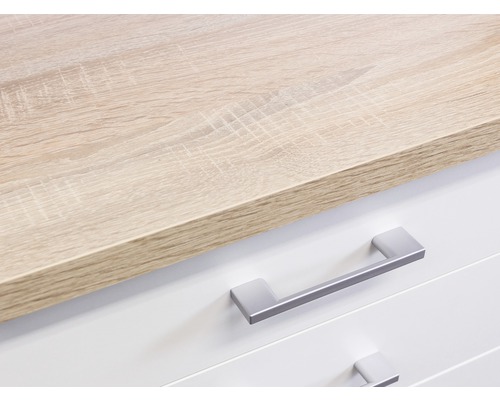 Detailopname van een ladekast met lades en een houten blad