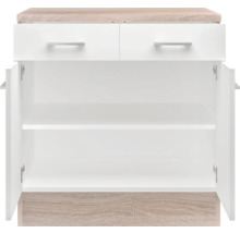 Witte onderkast met twee laden en open deuren.