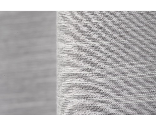 Detailopname van een grijze meubelstof met een fijne weefstructuur