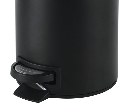 Gedeeltelijke weergave van een zwarte afvalemmer met voetpedaal.