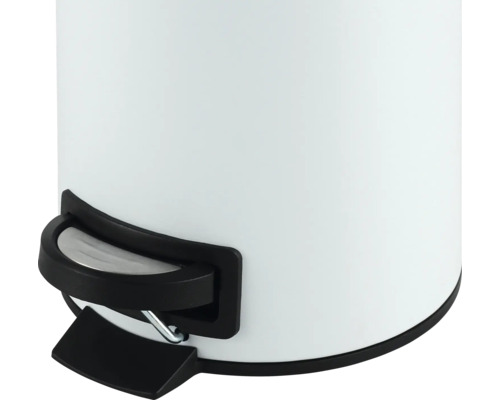 Detailopname van een witte afvalemmer met voetpedaal.