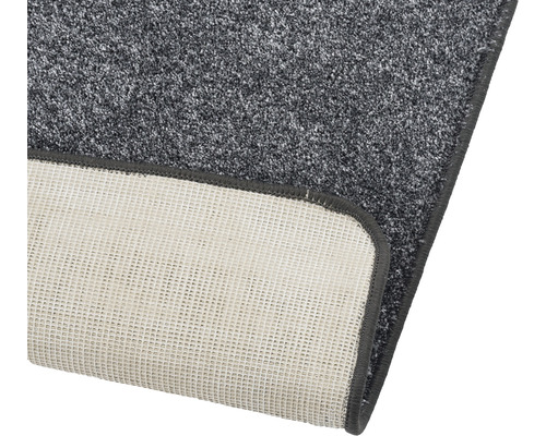 Detailopname van een grijs tapijt met textielrug