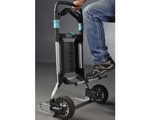 Wolfcraft transporthulp met opstapplank en persoon.