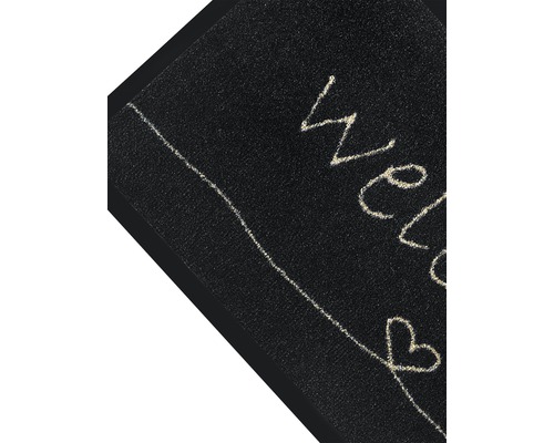 Zwarte deurmat met het woord welkom