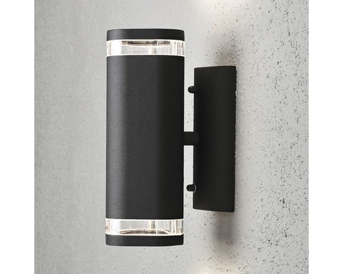 Zwarte wandlamp voor buiten met cilindrisch ontwerp.