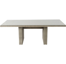 Eettafel met glazen blad en rotanstructuur