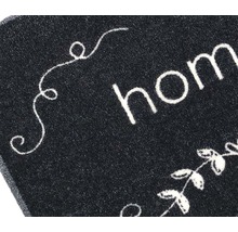 "Detailweergave van een deurmat met het woord ""Home""."