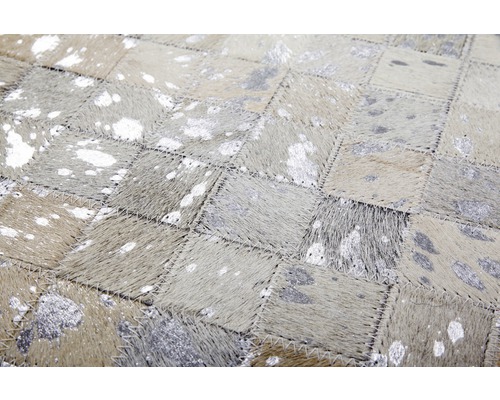 Runderleren tapijt in patchworkdesign