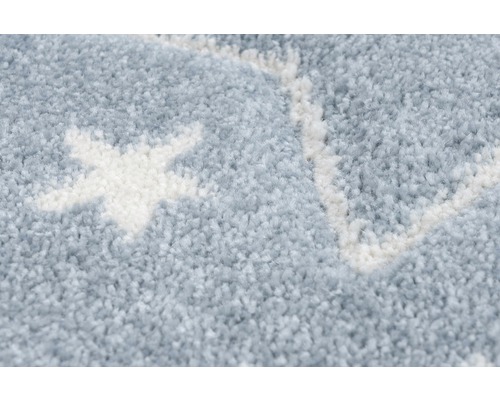 Close-up van een vloerkleed met sterrenpatroon