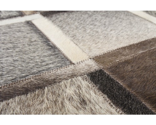 Vloerkleed van leren lappen met zigzagsteek