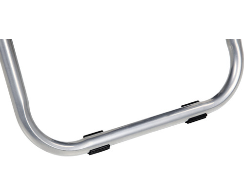 Detailopname van een metalen frame met rubberen stoppen