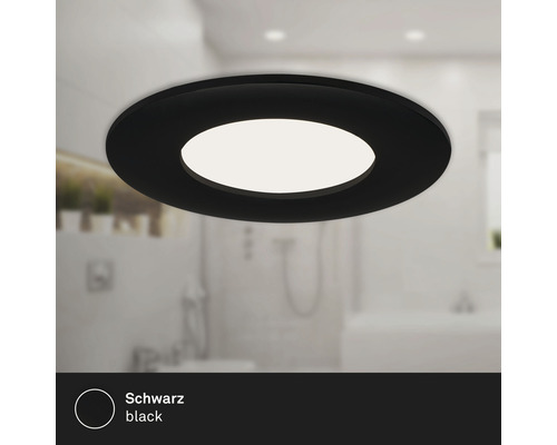 Zwarte ronde plafondlamp in badkamer