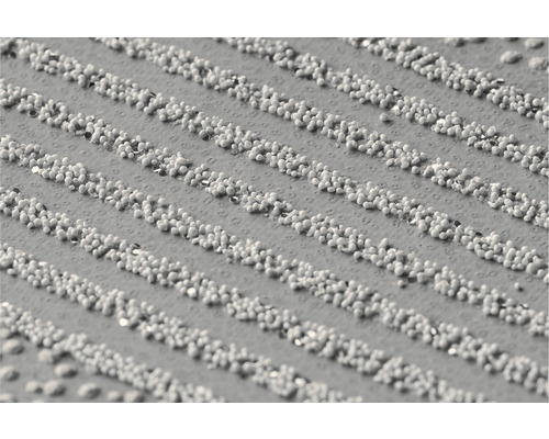 Detailopname van een deurmat met noppenstructuur