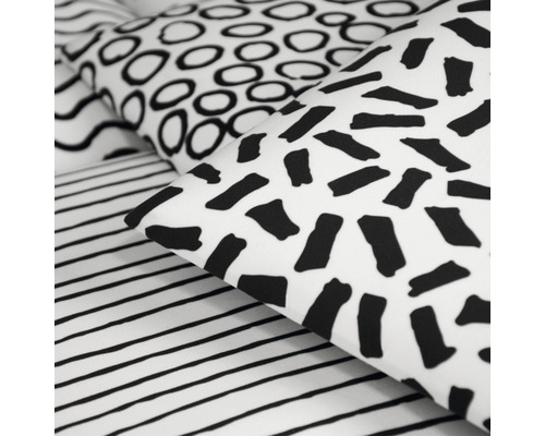 Beddengoed met verschillende geometrische patronen