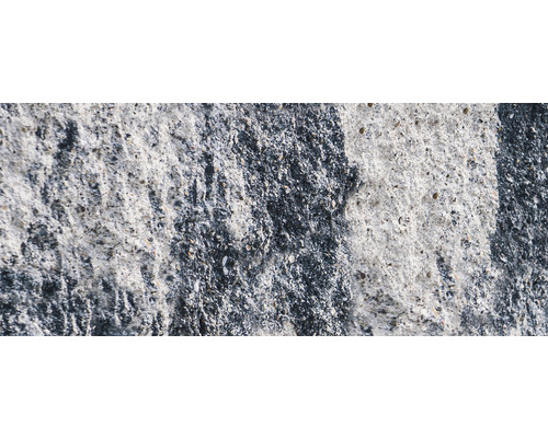 Close-up van een betonnen muur met ruwe textuur