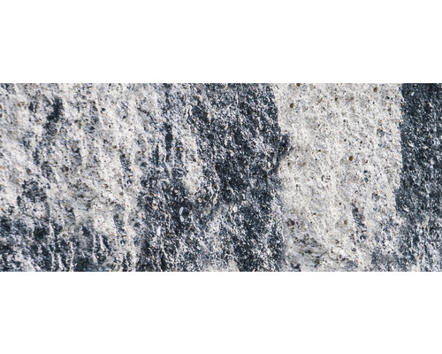 Close-up van een betonnen muur met ruw oppervlak