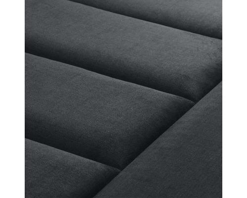 Close-up van een gestoffeerd meubel met stoffen bekleding