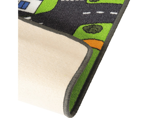 Detailopname van een kinderspeelkleed met straatmotief