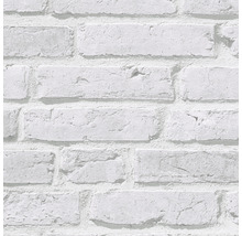 Close-up van een behang met baksteenmotief.