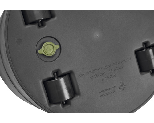 Onderkant van een ronde plantenbak met wielen, waterafvoerplug en fabrikantinformatie