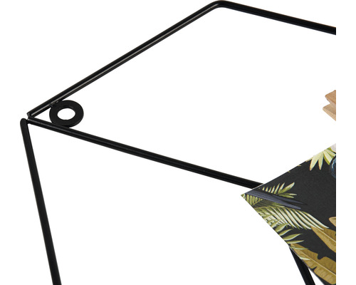 Detailopname van een zwarte, metalen plantenkruk