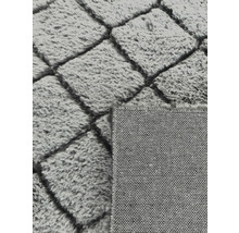 Grijs vloerkleed met geometrisch patroon en pool
