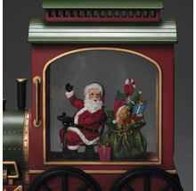 Kersttrein met de kerstman, geschenken en een teddybeer