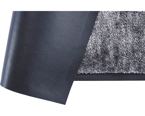 Gedetailleerde weergave van een zwarte antislipmat met textieloppervlak