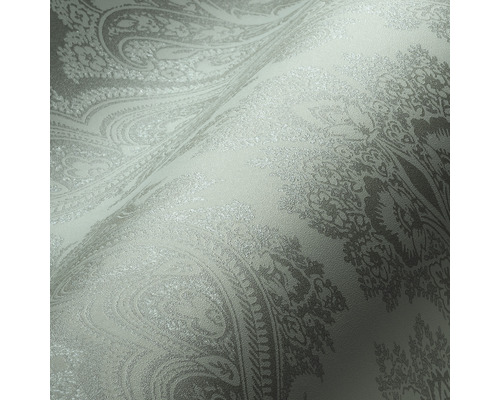 Close-up van een behang met bloemmotieven en ornamenten