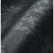Close-up van een zwart behang met paisley patroon
