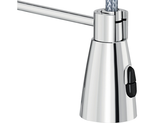 Detailopname van een lamp met een chromen oppervlak en een schakelaar