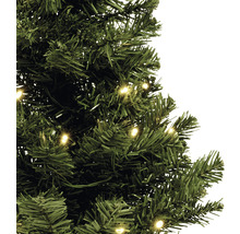 Detailopname van een groene, kunstmatige kerstboom met verlichting