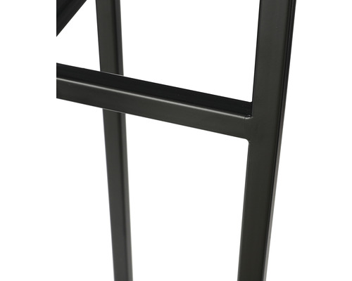 Detailopname van een meubelstuk met een zwart metalen frame.