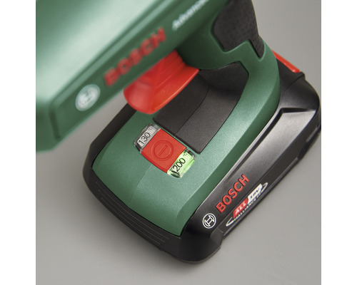 Detailopname van een Bosch schuurmachine met batterij en rode schakelaar