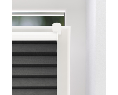 Detailweergave van een plisségordijn op het raam