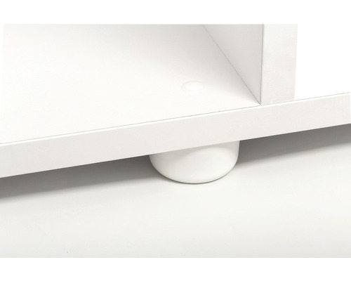 Detailopname van een wit meubelstuk met een ronde voet