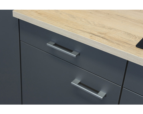 Detail van een onderkast met werkblad en lades