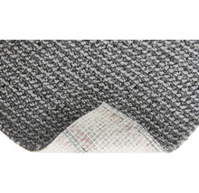 Close-up van een grijs tapijt met textielrug