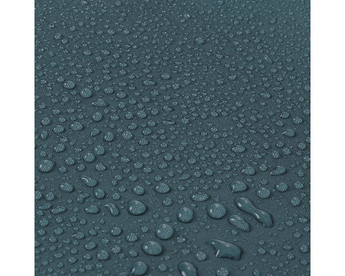 Close-up van waterafstotende stof met waterdruppels