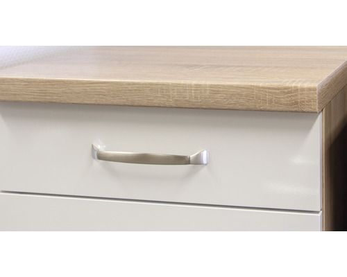 Detailopname van een meubelstuk met lade en handgreep