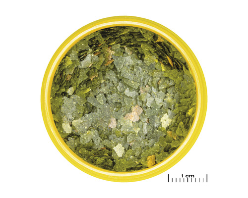 Visvoer vlokken in een gele doos