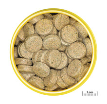 Visvoedingtabletten in gele container