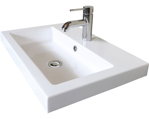 Witte wastafel met kraan