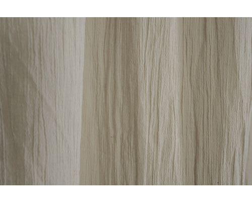 Close-up van beige, gestructureerde gordijnstof