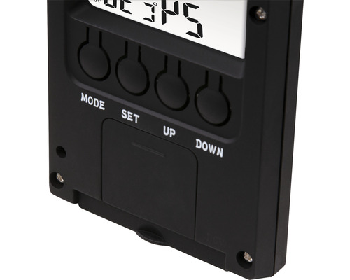 Close-up van een zwart weerstation met digitaal display en bedieningsknoppen.