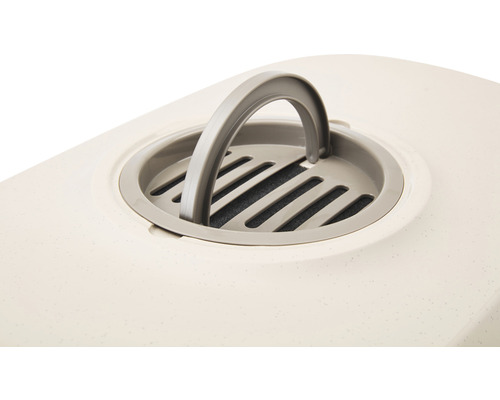 Detail van een kattenbak met filter en handvat