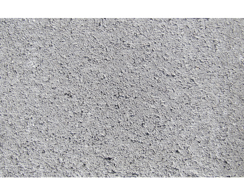 Close-up van een betonnen muur met een ruw oppervlak