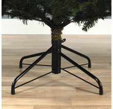 Kerstboomstandaard met vier poten onder een kunstkerstboom